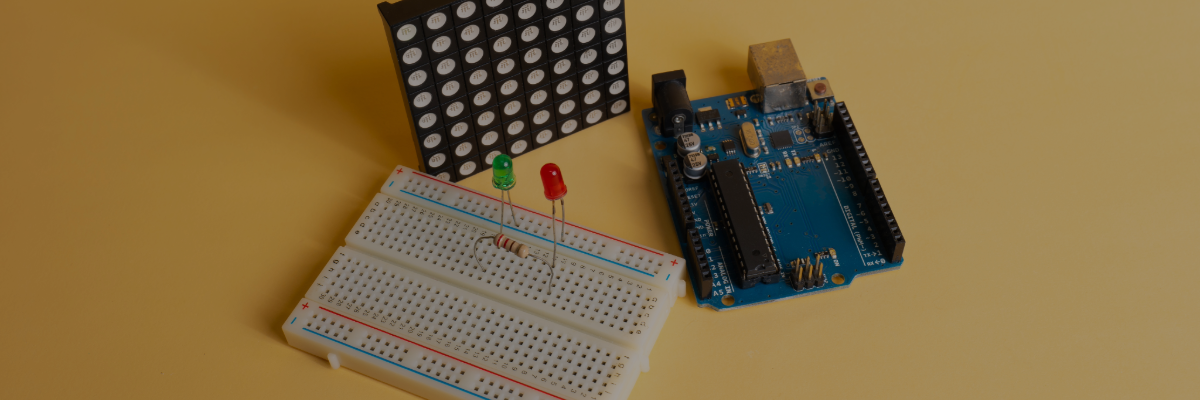An Electronic Circuit Building Kit on a yellow table.