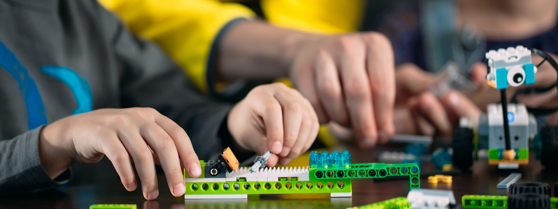 Child playing with building bricks and materials.