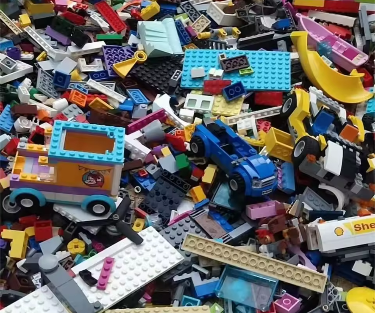 Assorted colorful toy building blocks scattered together