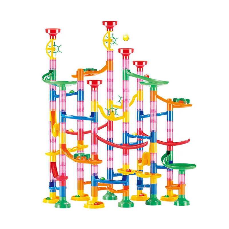 Colorful marble run toy set with a marble rolling through it on a white background