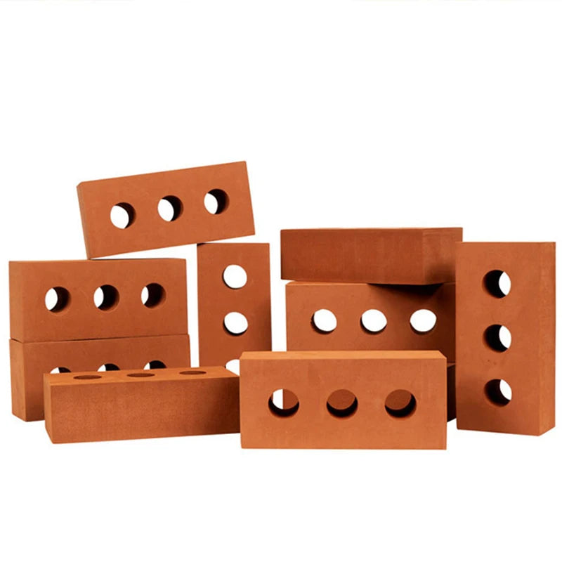 Set of red bricks with circular holes on a white background