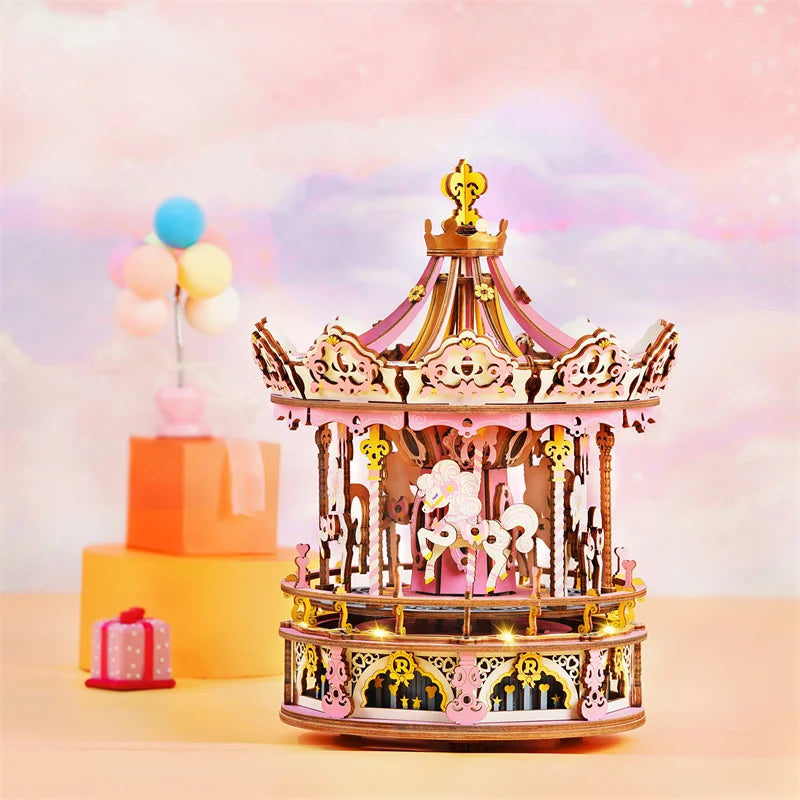 Decorative carousel model with lights on a pastel background