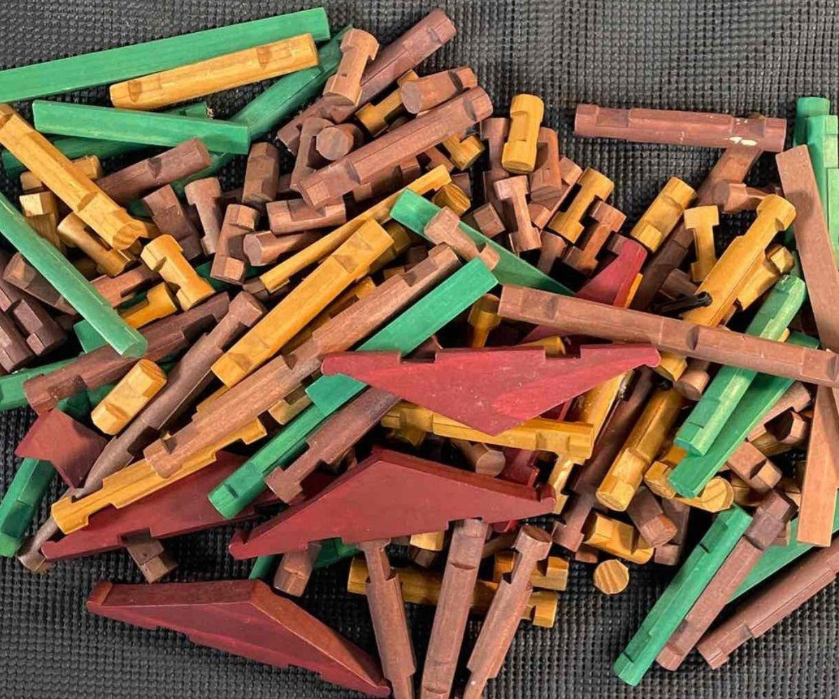 Colorful wooden building blocks scattered on a dark surface