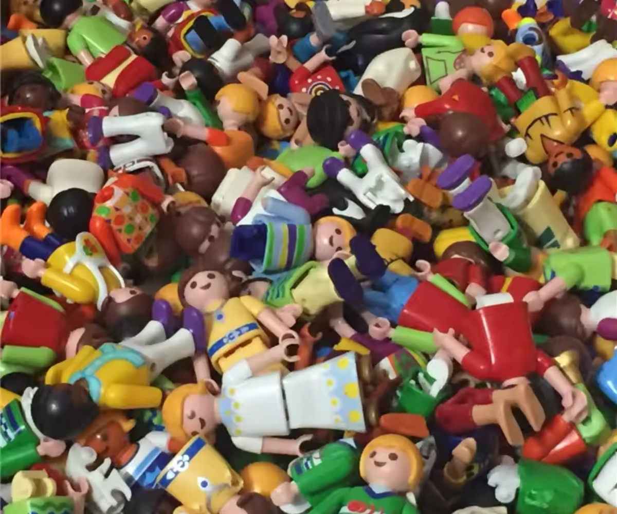Pile of colorful toy figures with various poses and outfits.