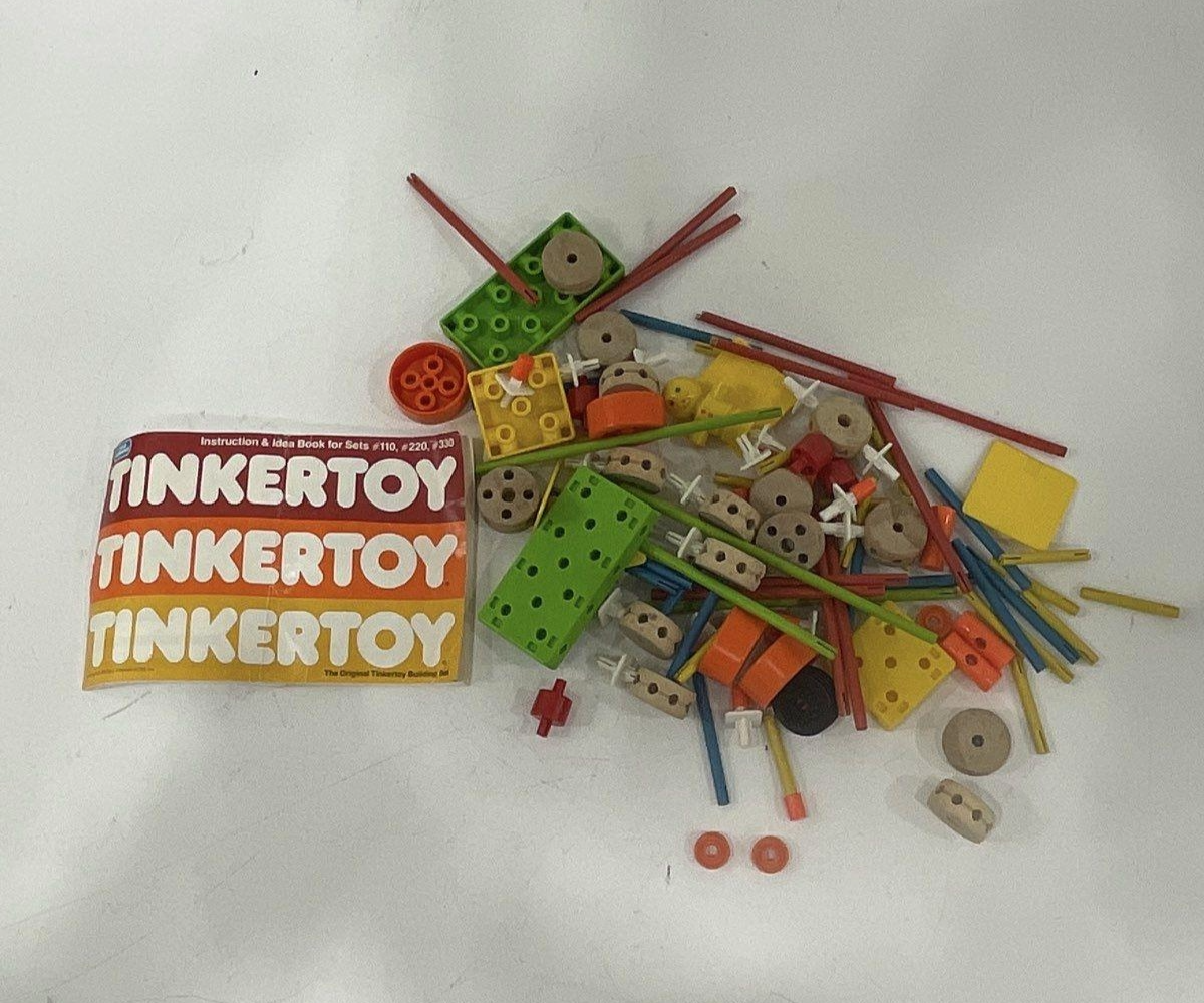 Tinkertoy toy set with packaging on a white background