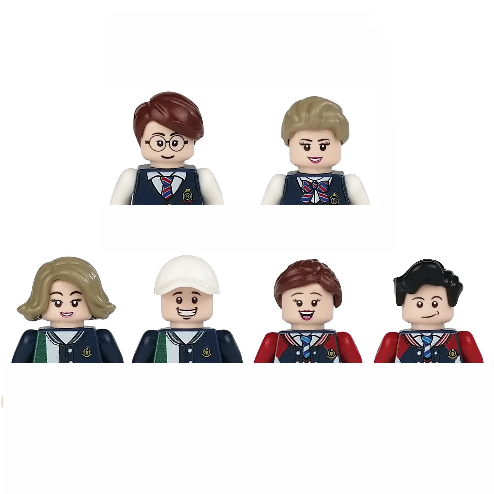 Set of five toy figures in school uniforms on a white background
