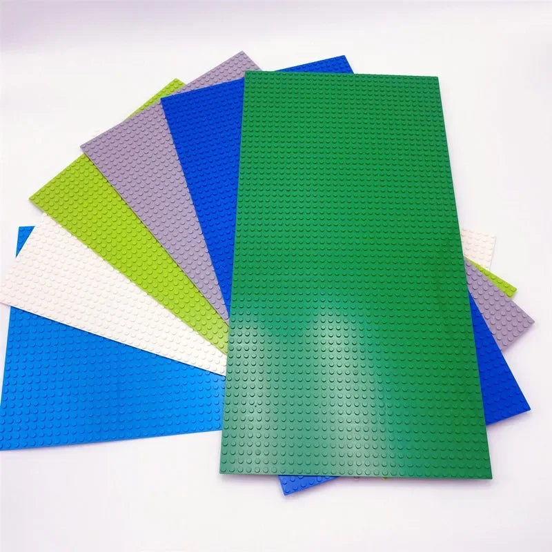 Set of colorful building block bases on a white background