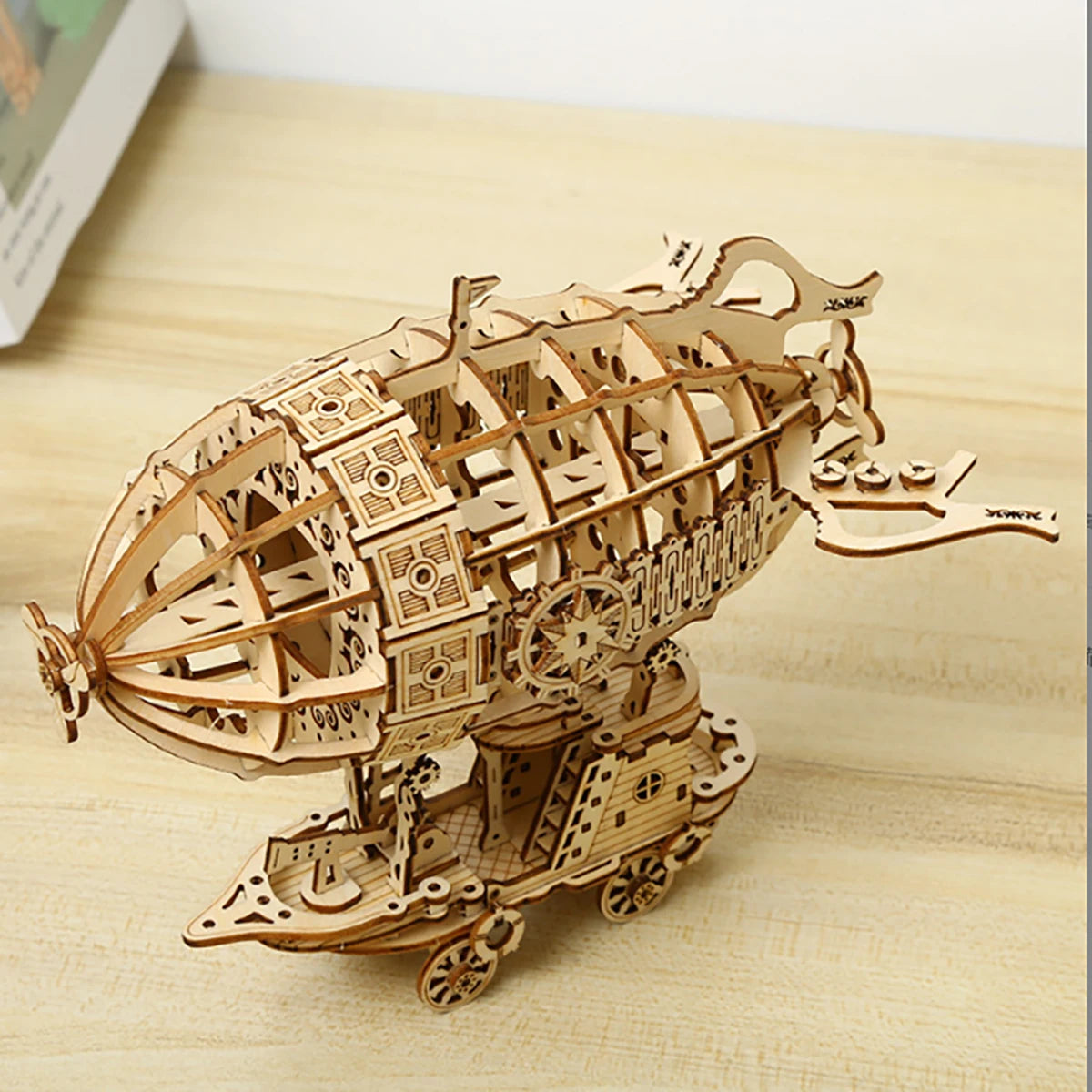 Wooden mechanical model of a ship on a wooden surface