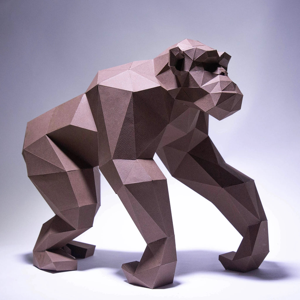Geometric brown bear sculpture on a white background