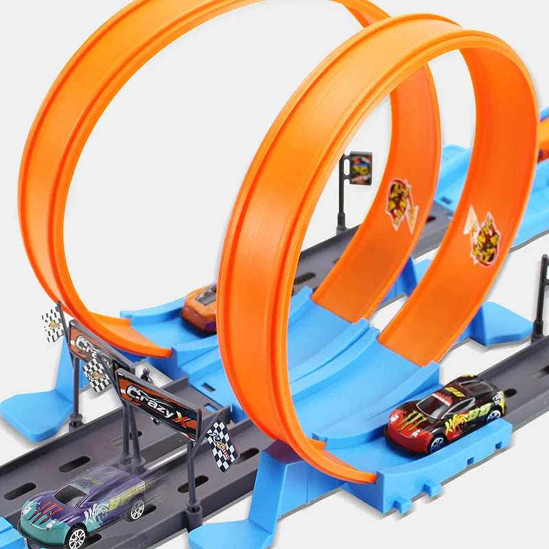 Toy car track set with orange loops and cars on a white background