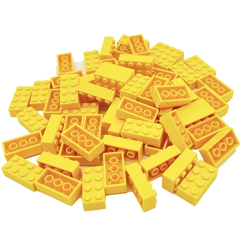 Pile of yellow building blocks on a white background