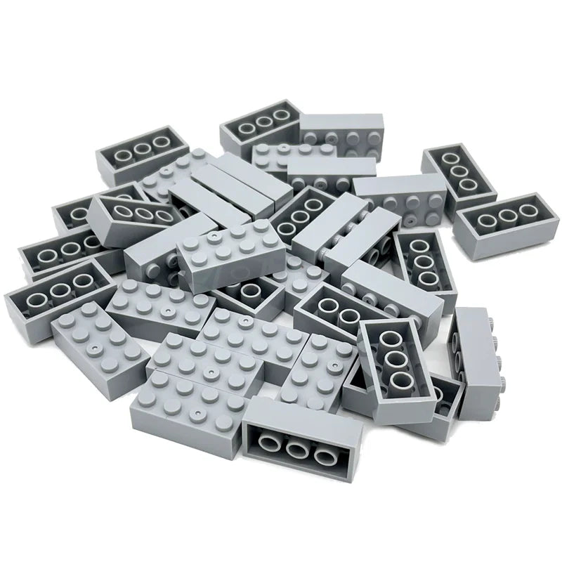 Pile of gray building blocks on a white background