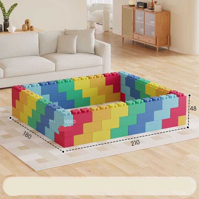 Colorful building blocks arranged to form a small table in a living room setting.