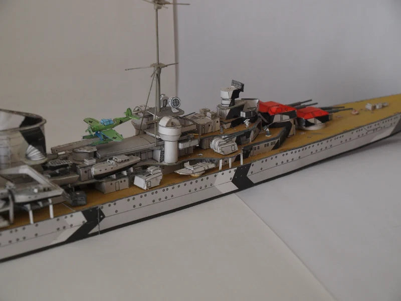 Model of a battleship on a white surface