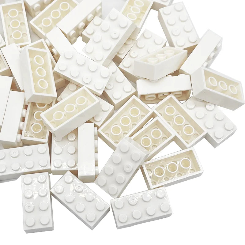 White building blocks with gold accents on a white background