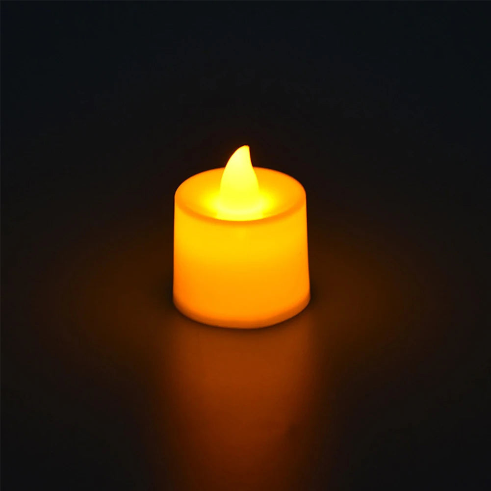 Flameless candle with a warm glow on a dark background
