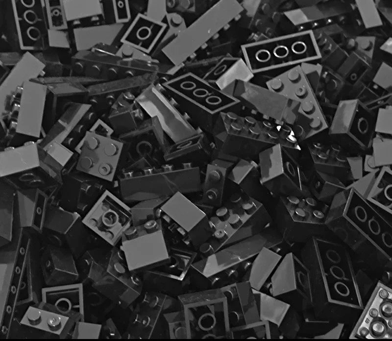 Pile of black and gray building blocks