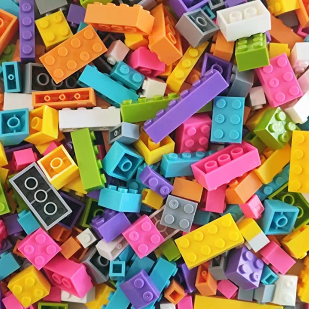 Assorted colorful building blocks scattered together