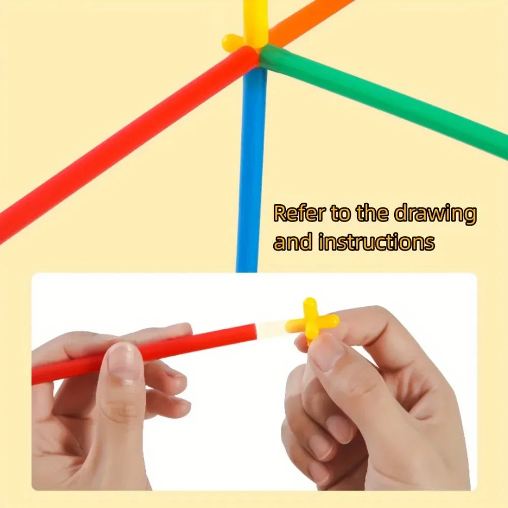 Colorful sticks forming a geometric shape with hands holding red and yellow sticks on a beige background.