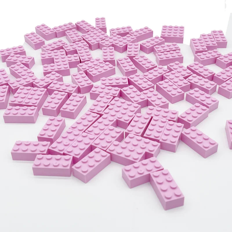 Pink building blocks on a white background