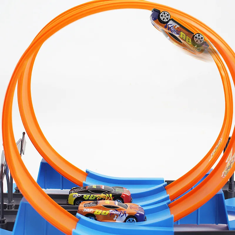 Toy car track set with orange loops and blue base on a white background