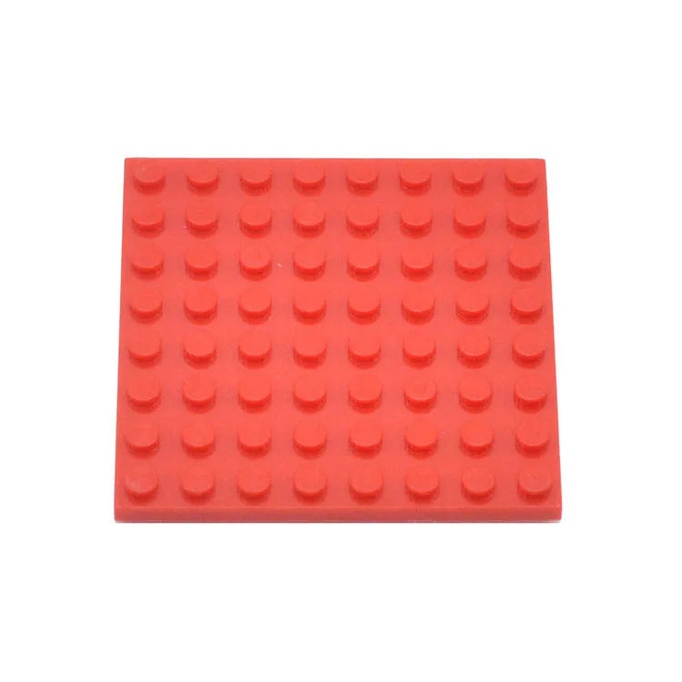 Red building block baseplate on a white background