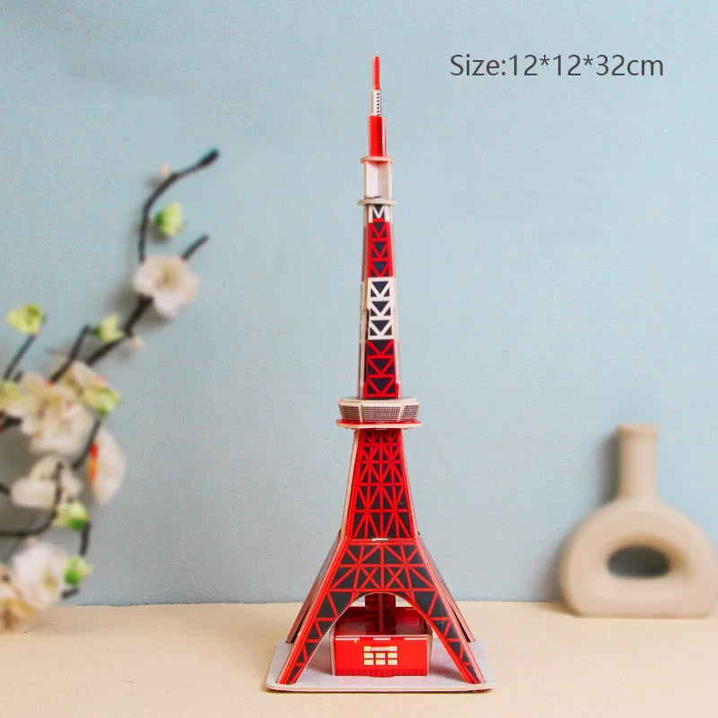 Model of the Eiffel Tower with red and white design on a light blue background