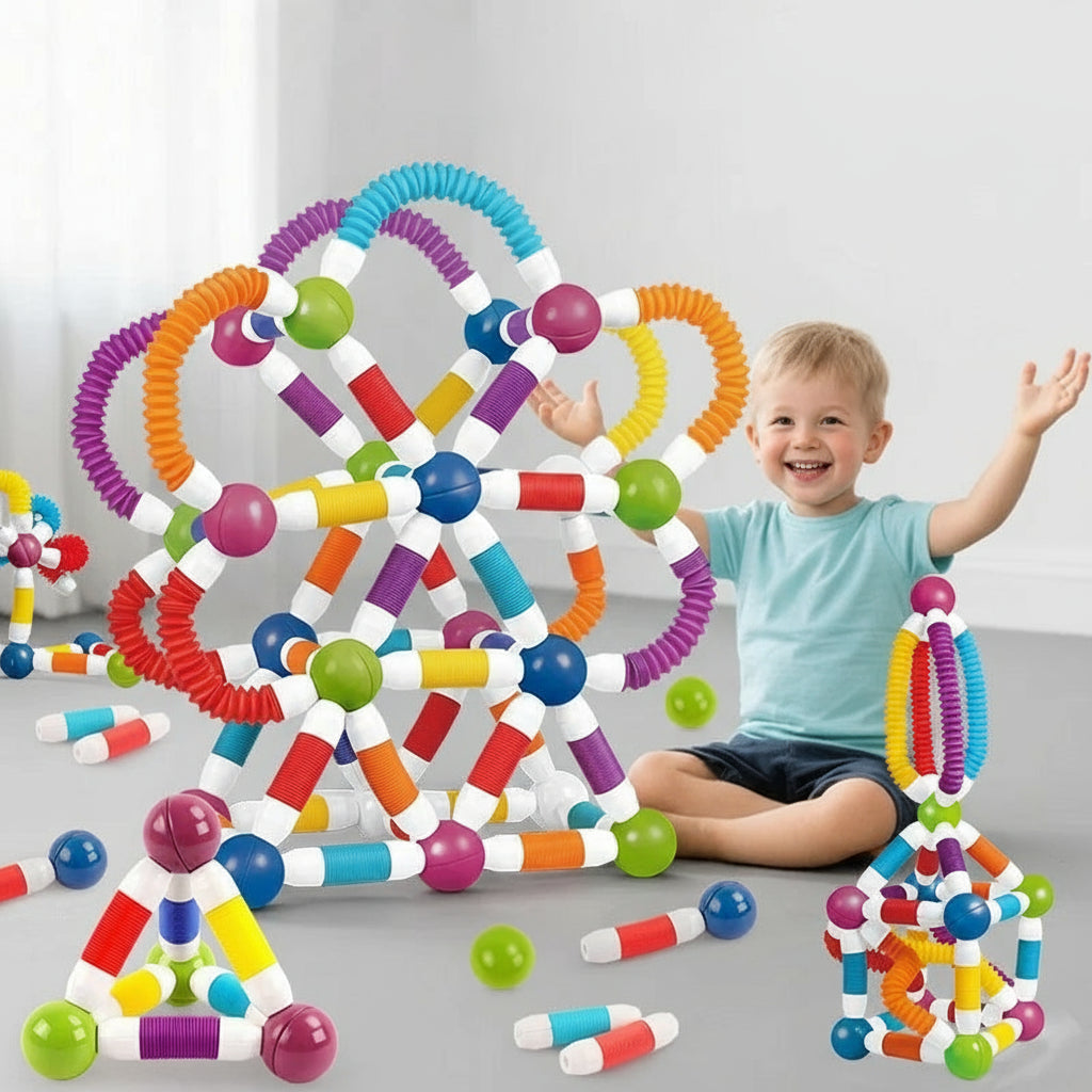 Child playing with colorful magnetic flexible sticks on a gray floor.
