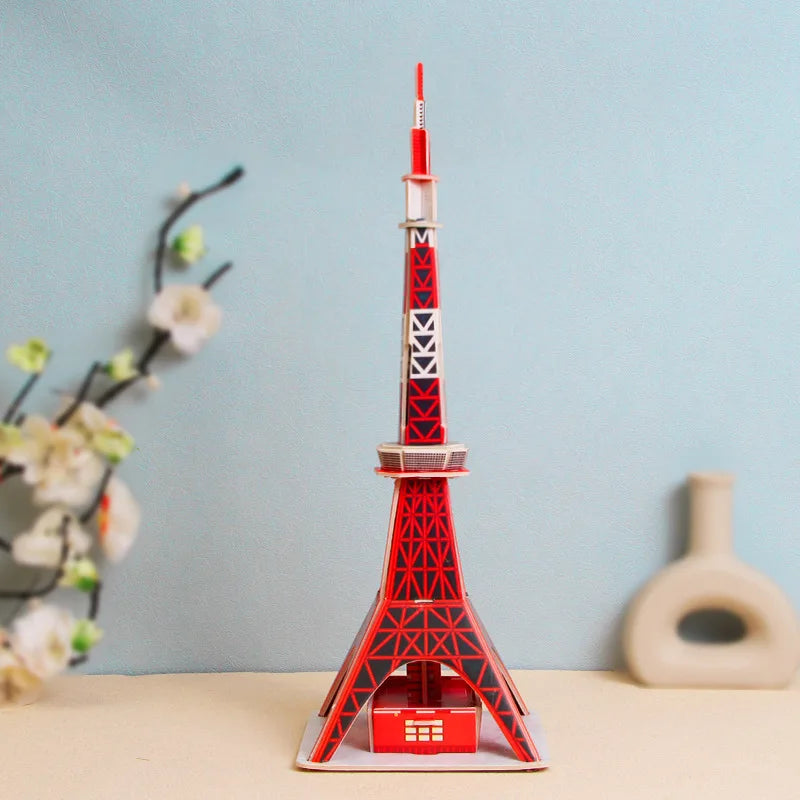 Model of the Tokyo Tower on a table with a light blue background