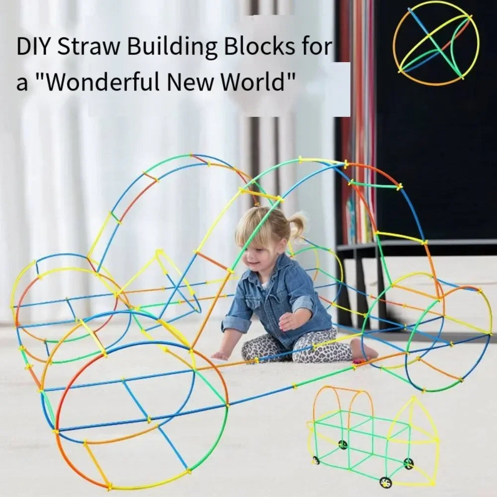 Child playing with colorful straw building blocks on a light surface.