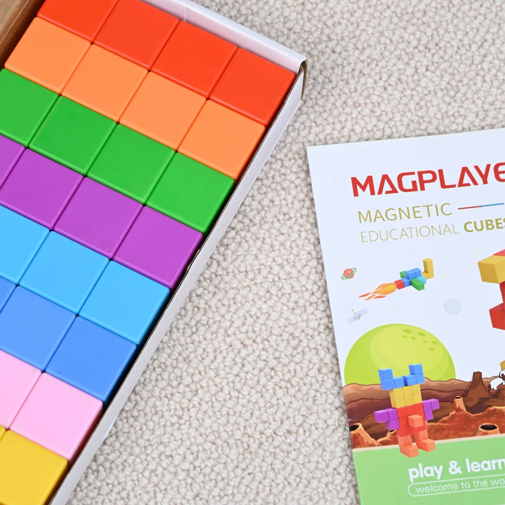 Colorful magnetic educational cubes with packaging on a textured surface