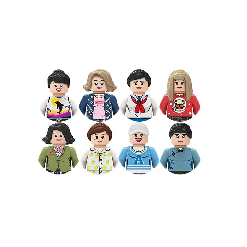 Set of eight small figurines with different outfits on a white background