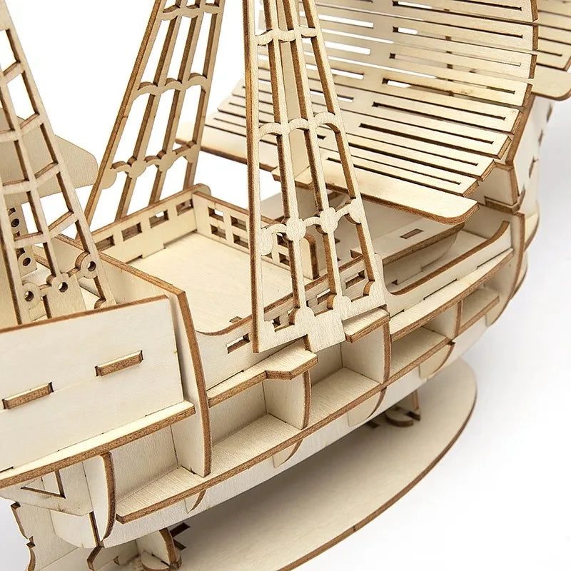 Wooden model ship kit on a white background