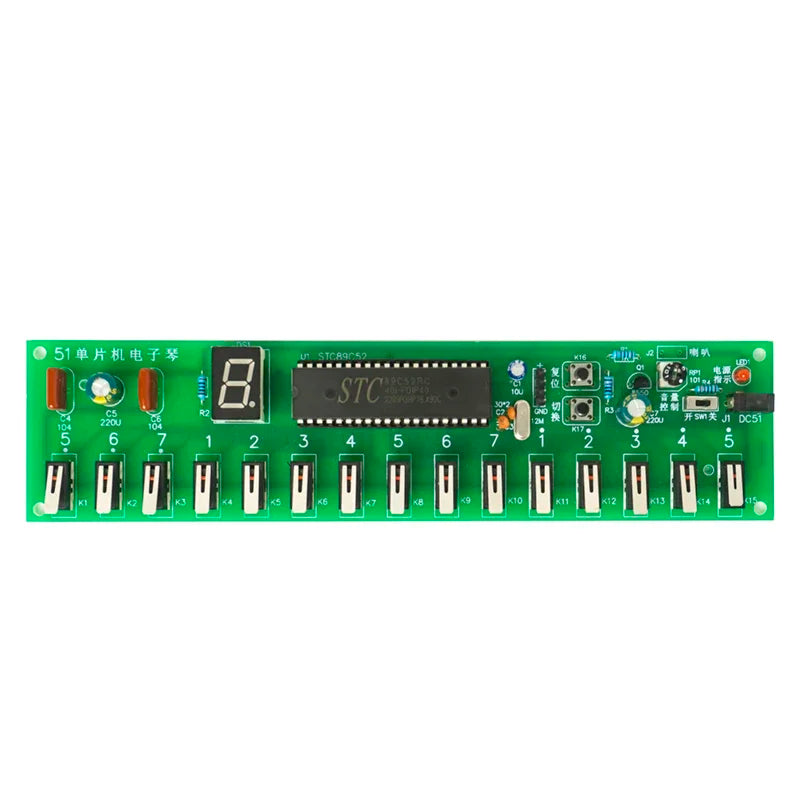 Green electronic circuit board with STC microcontroller on a white background