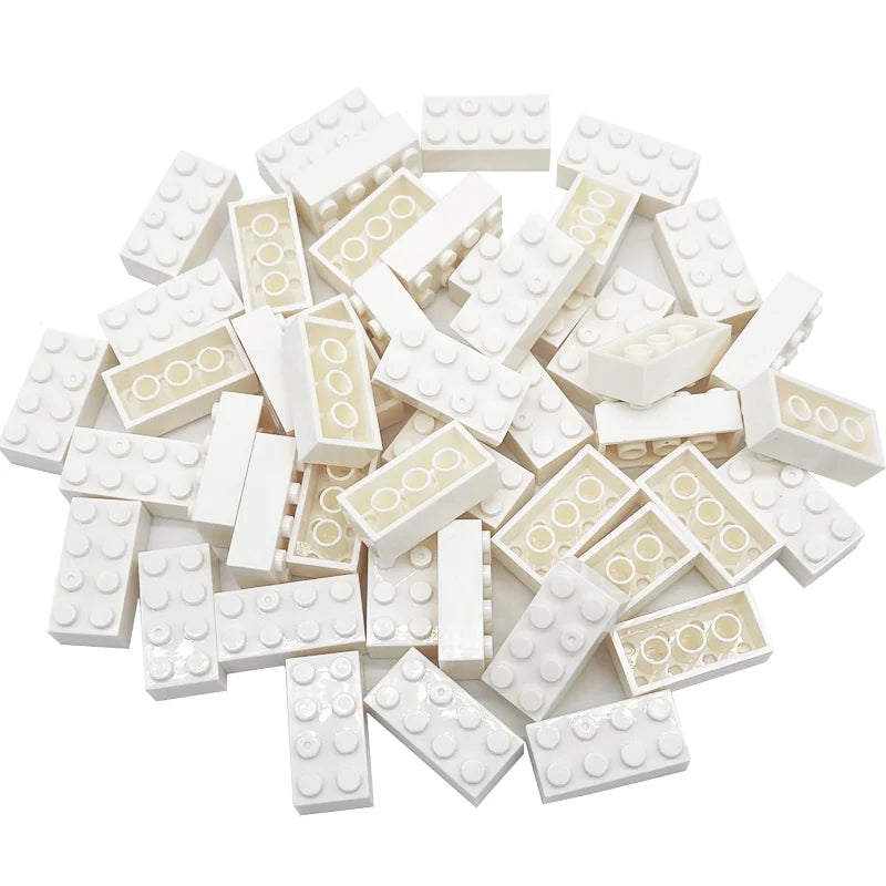 Pile of white building blocks with beige patterns on a white background