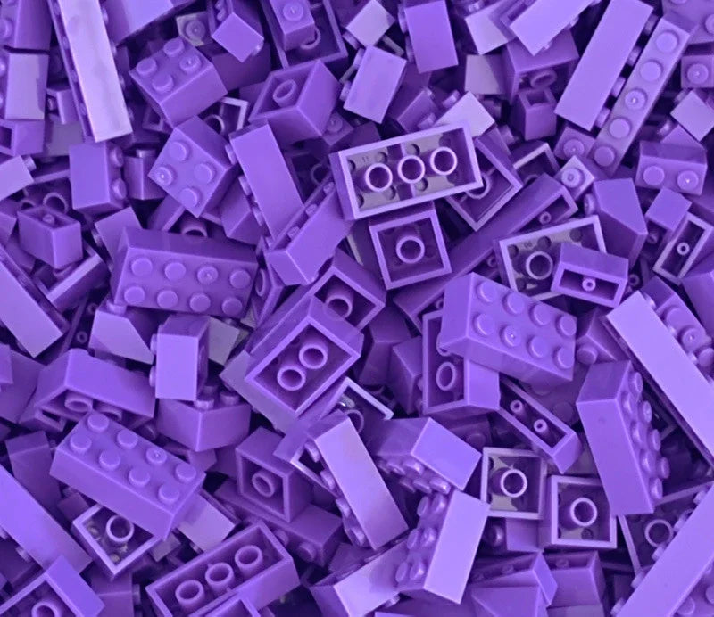 Purple building blocks scattered together