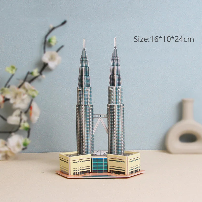 Model of Petronas Towers on a table with a light blue background