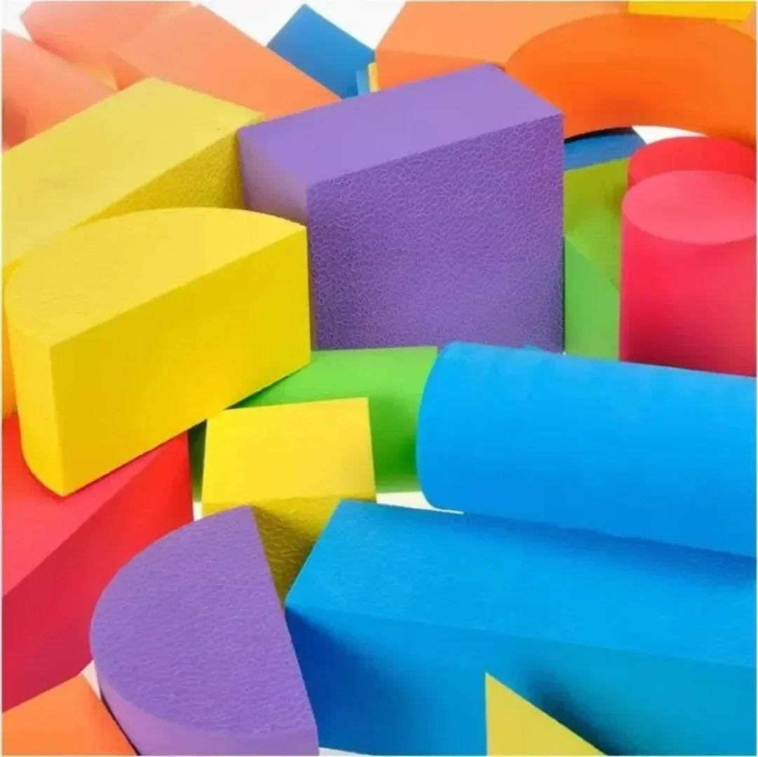 Colorful foam blocks in various shapes and sizes on a white background