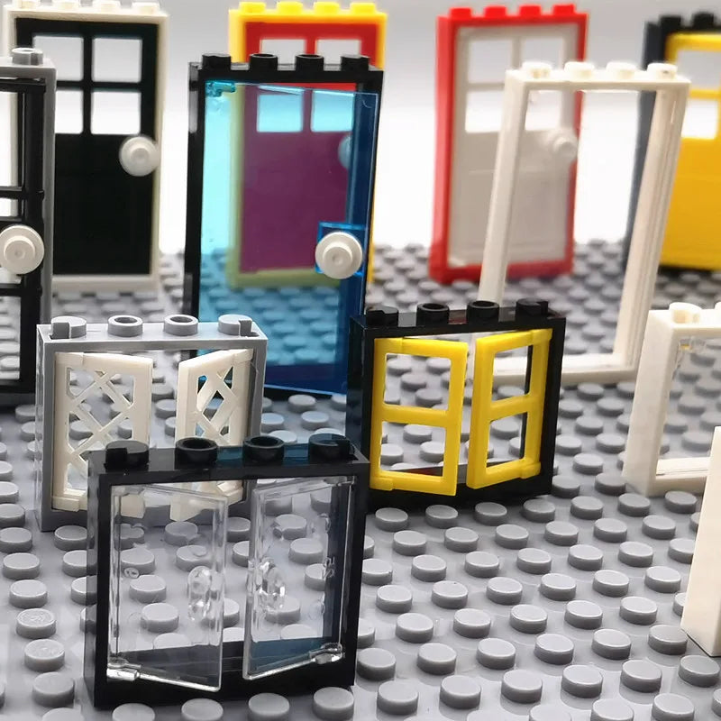 Toy building blocks with various shapes and colors on a gray baseplate