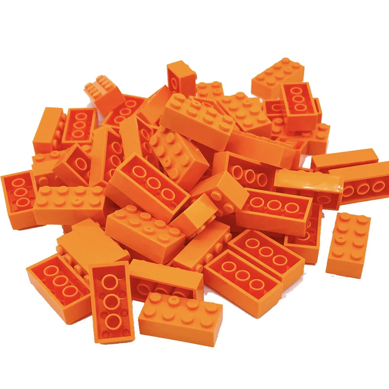 Pile of orange building blocks on a white background