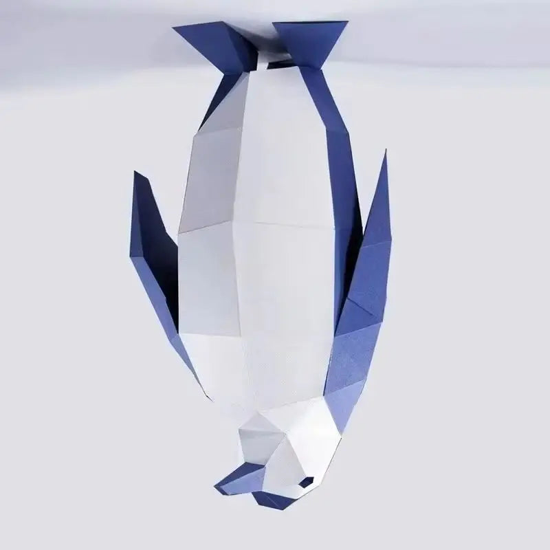 Geometric paper sculpture of a penguin on a white background