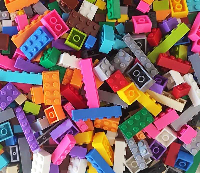 Assorted colorful building blocks scattered together