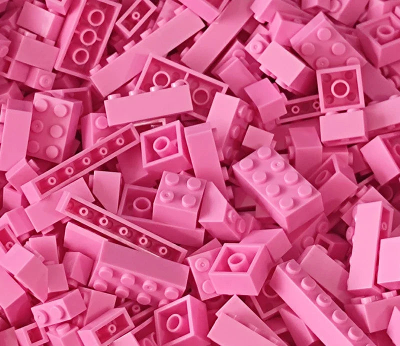 Pink building blocks scattered together