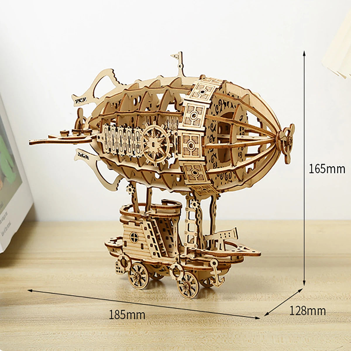 Wooden mechanical model ship with dimensions on a light surface