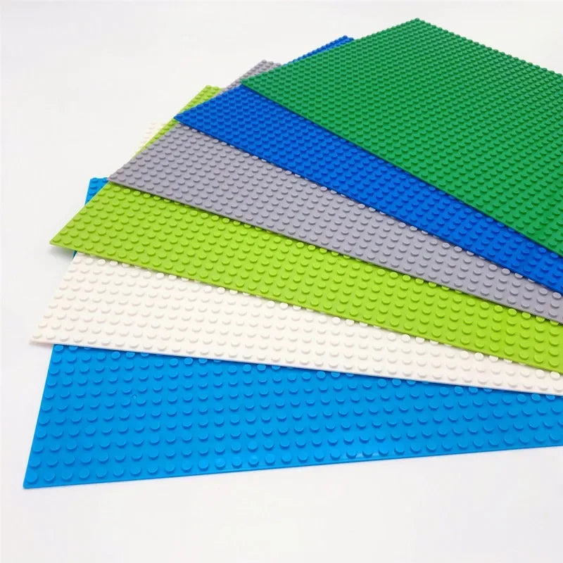 Set of colorful building block bases on a white background