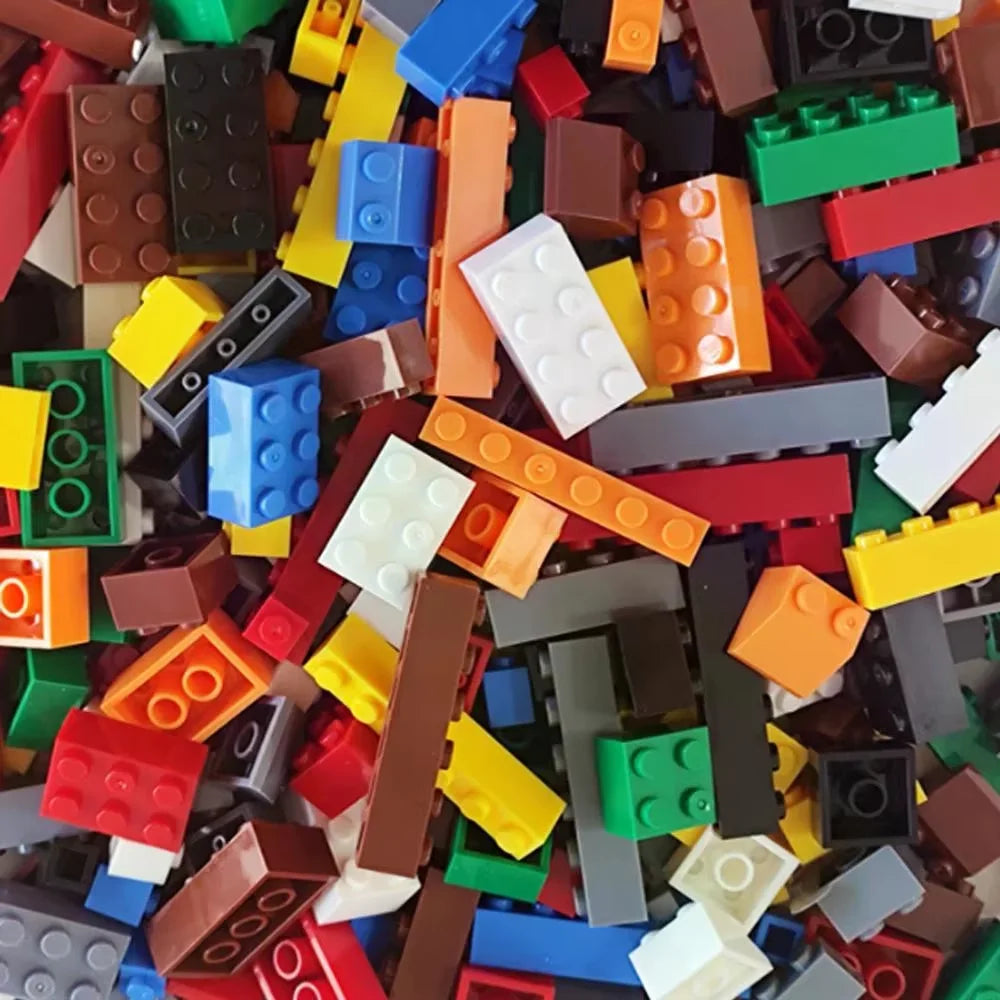 Assorted colorful building blocks scattered together