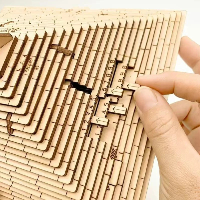 Wooden puzzle with laser-cut pieces and a hand interacting with it.