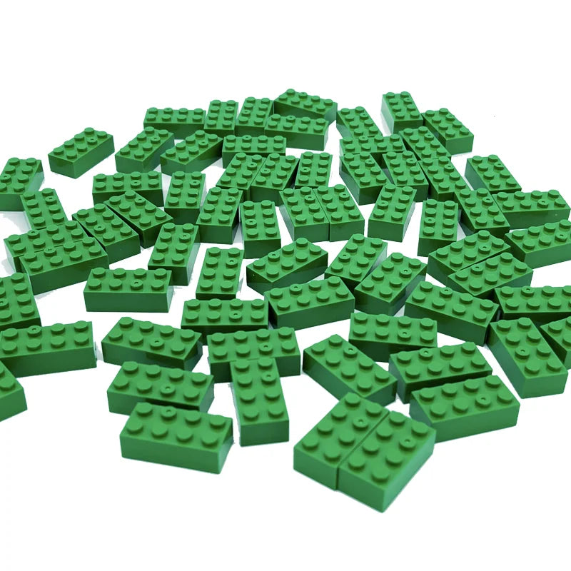 Pile of green building blocks on a white background