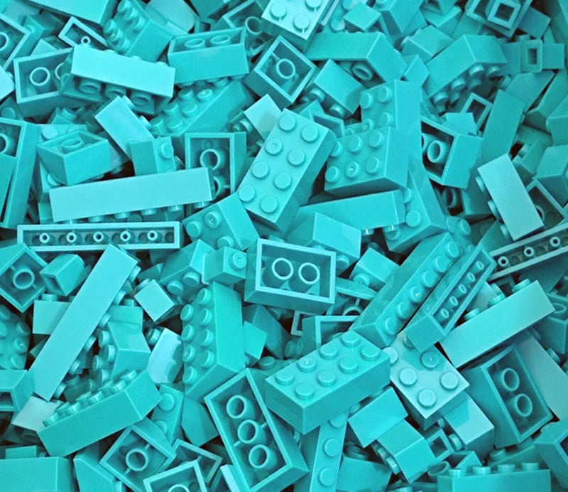 Turquoise building blocks scattered together