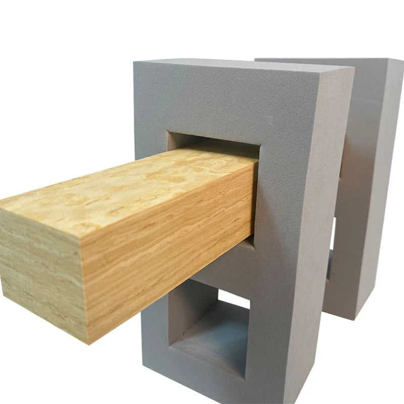 Modern chair with wooden seat and concrete-like gray frame on a white background